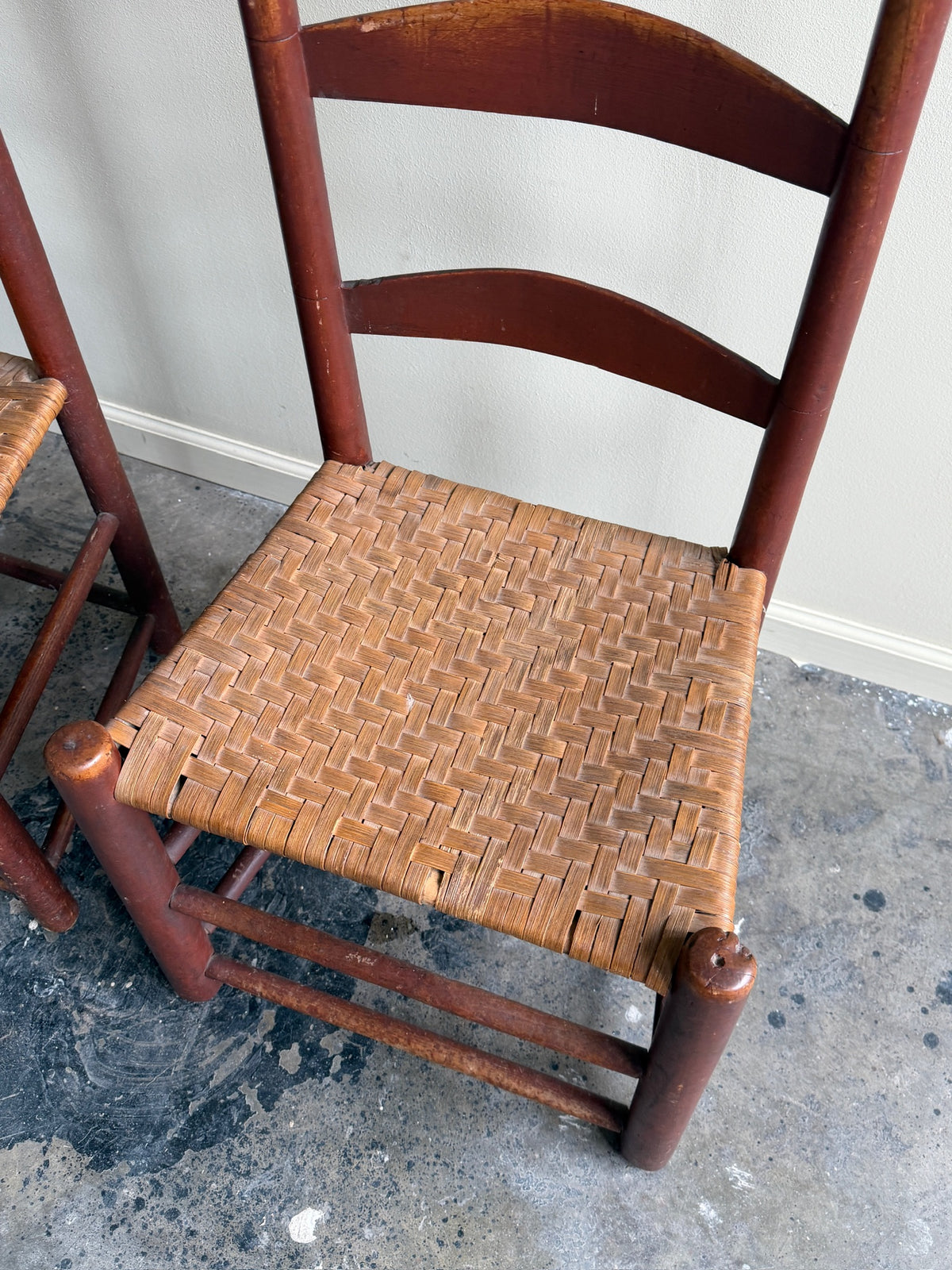 Pennsylvania painted maple ladder back chairs. Sold in pairs.