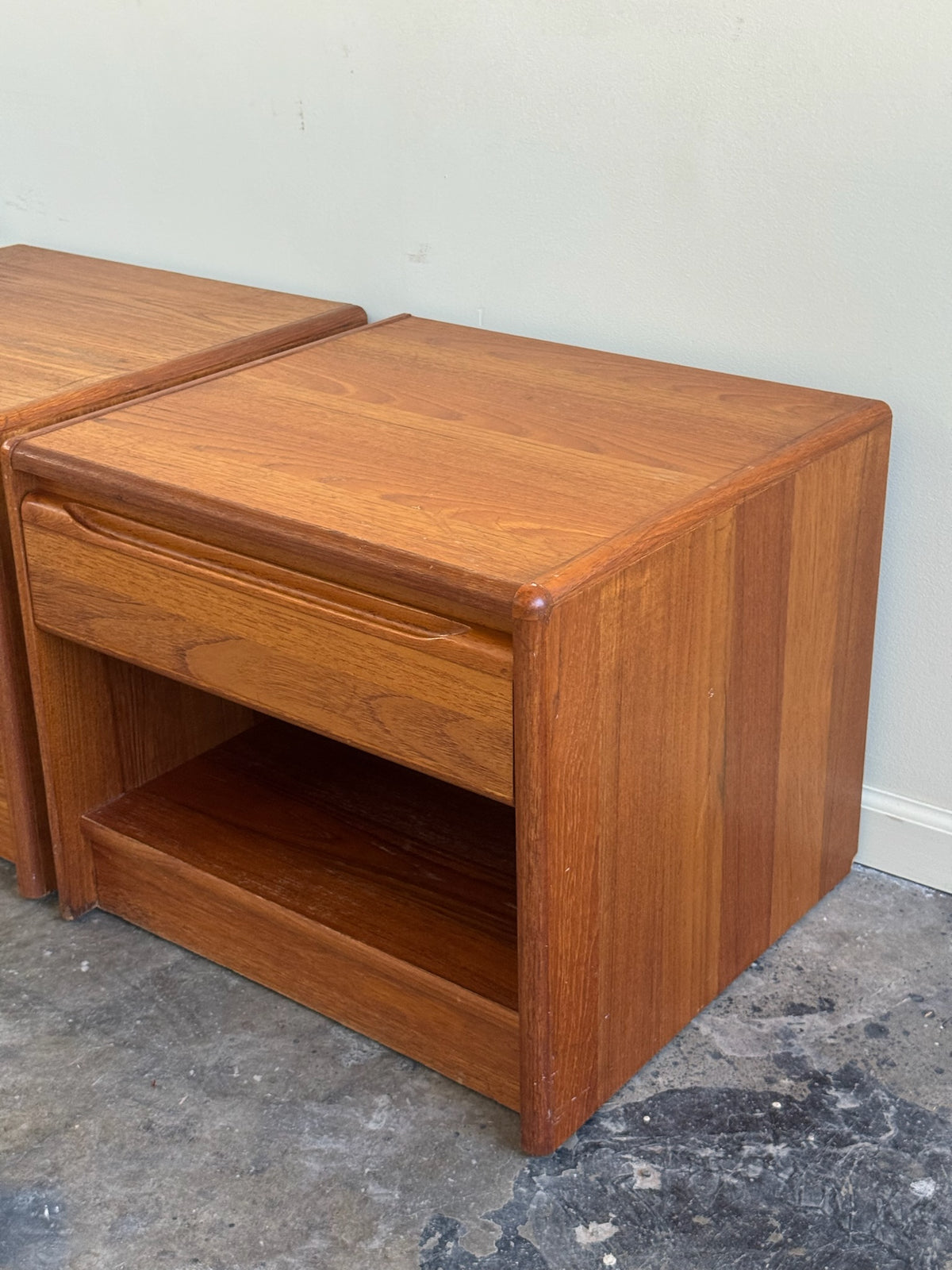 Danish teak nightstands. Sold as a pair.