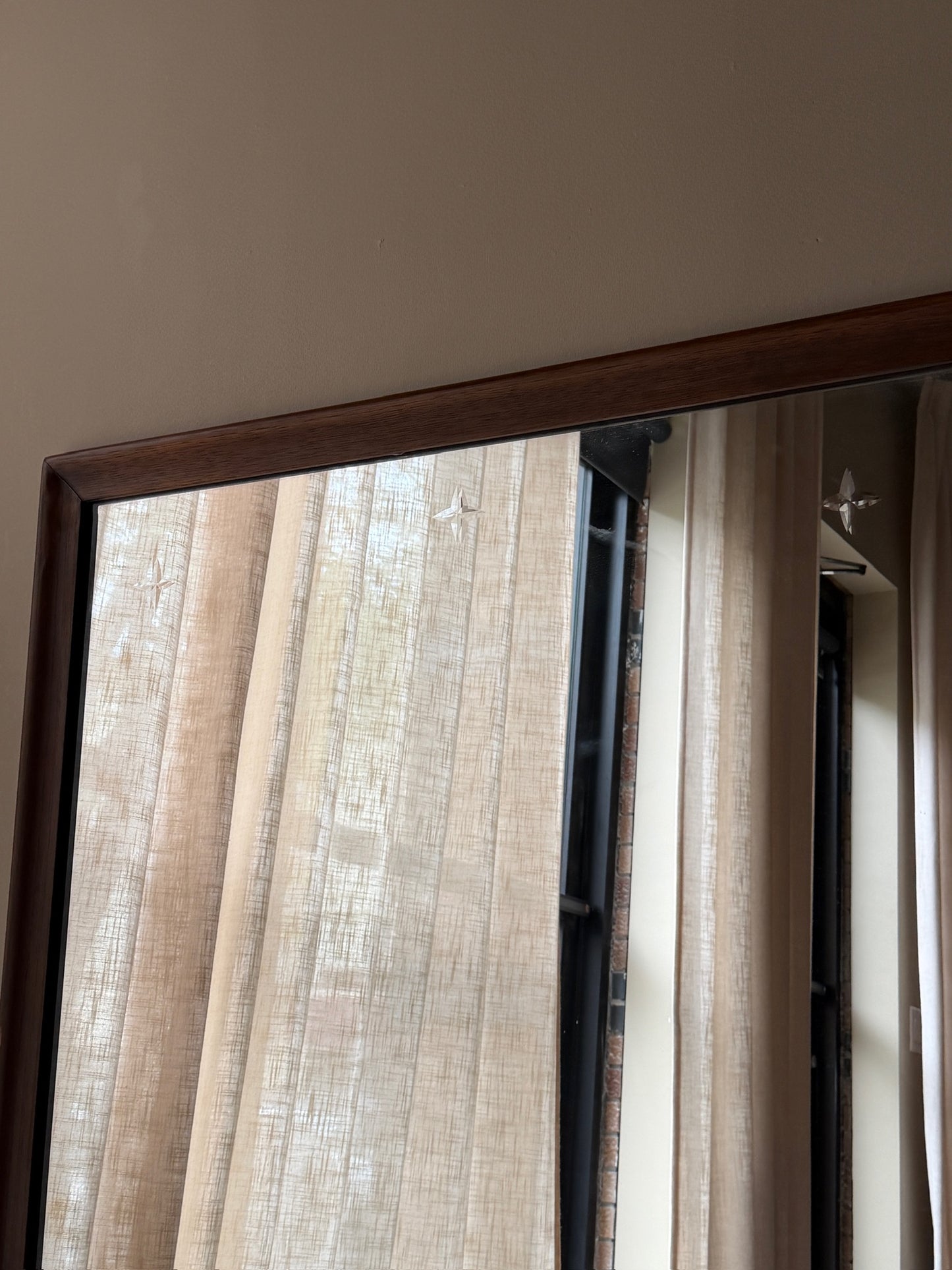 Walnut mirror with star etchings