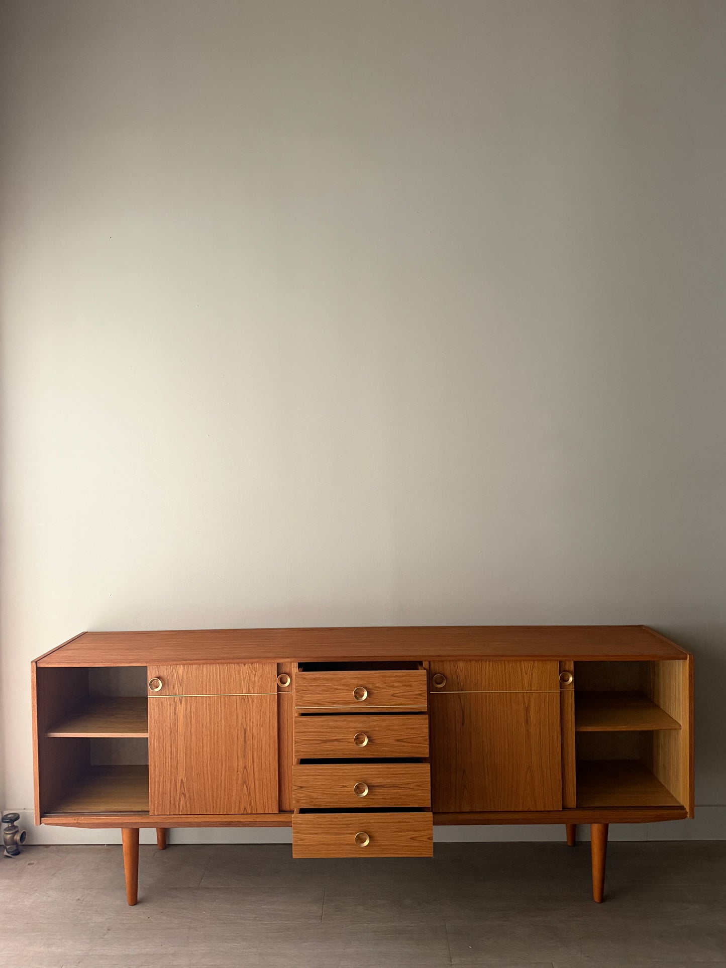 Danish teak sideboard with brass hardware