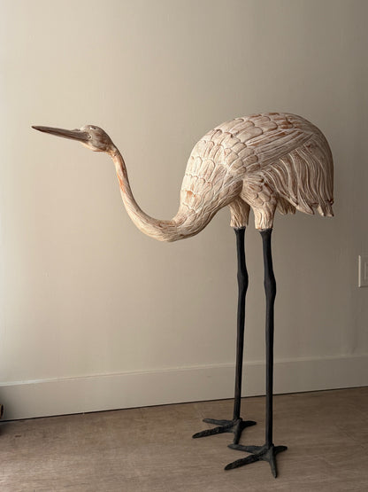 Wooden carved egret statue with iron legs