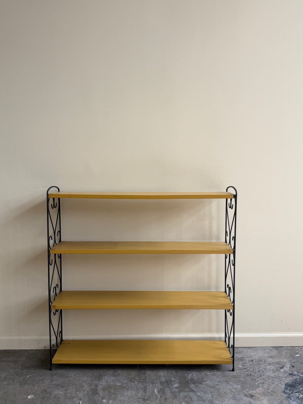 Yellow painted metal shelf