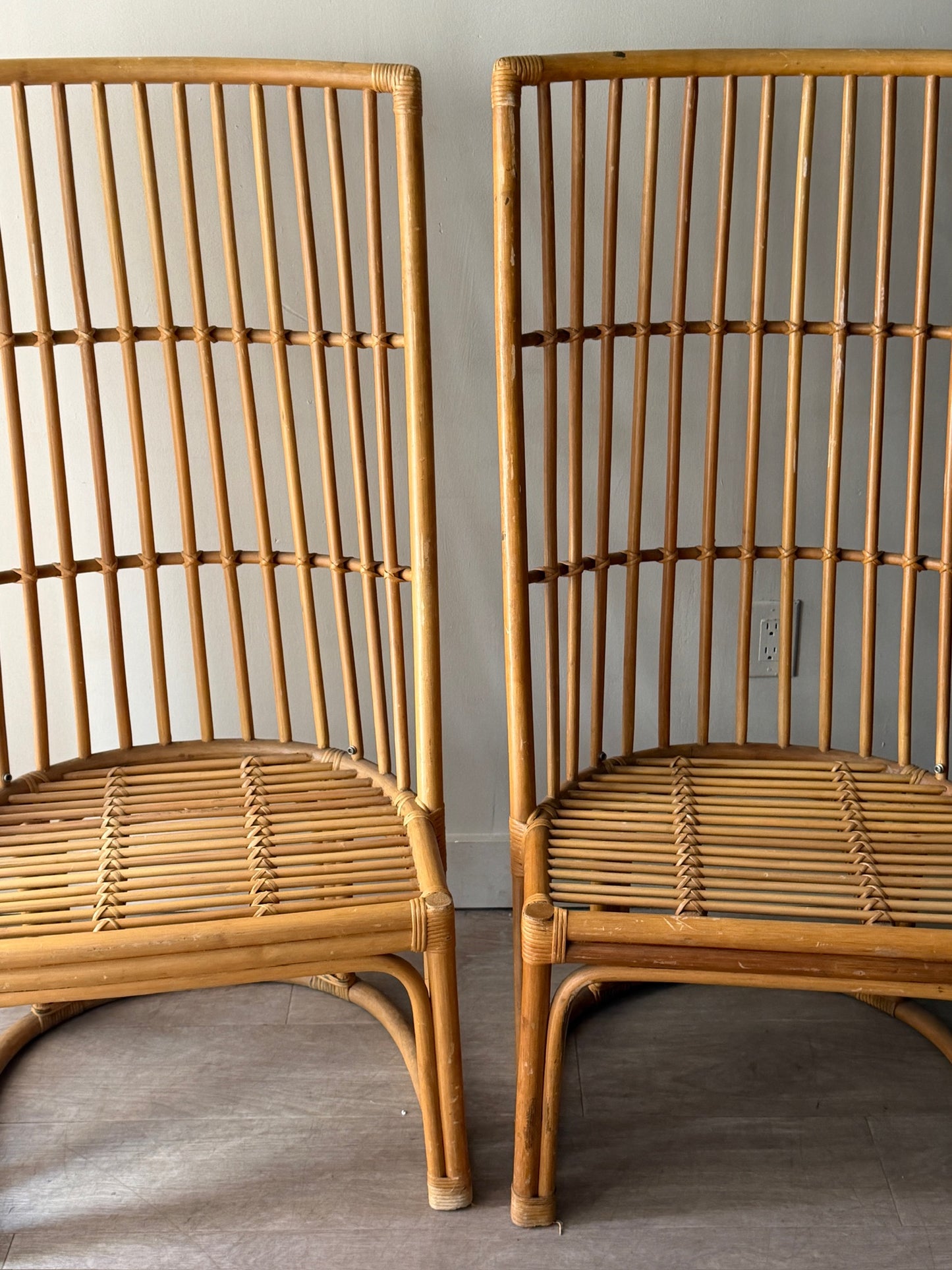 Rattan chairs. Sold individually.