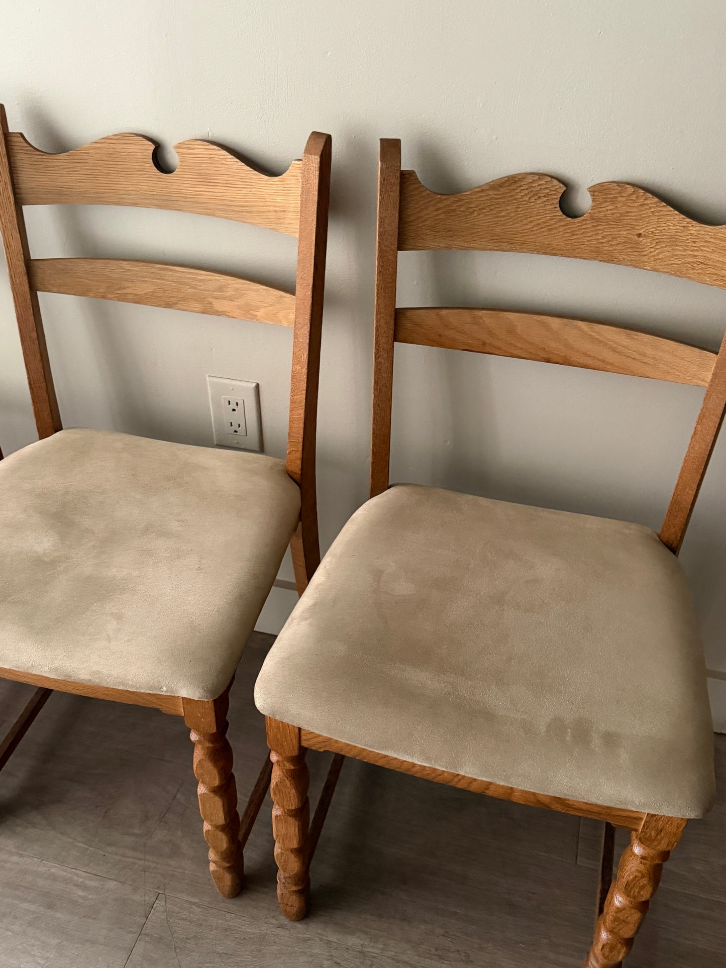 Danish oak dining chairs with suede upholstery. Sold in pairs.