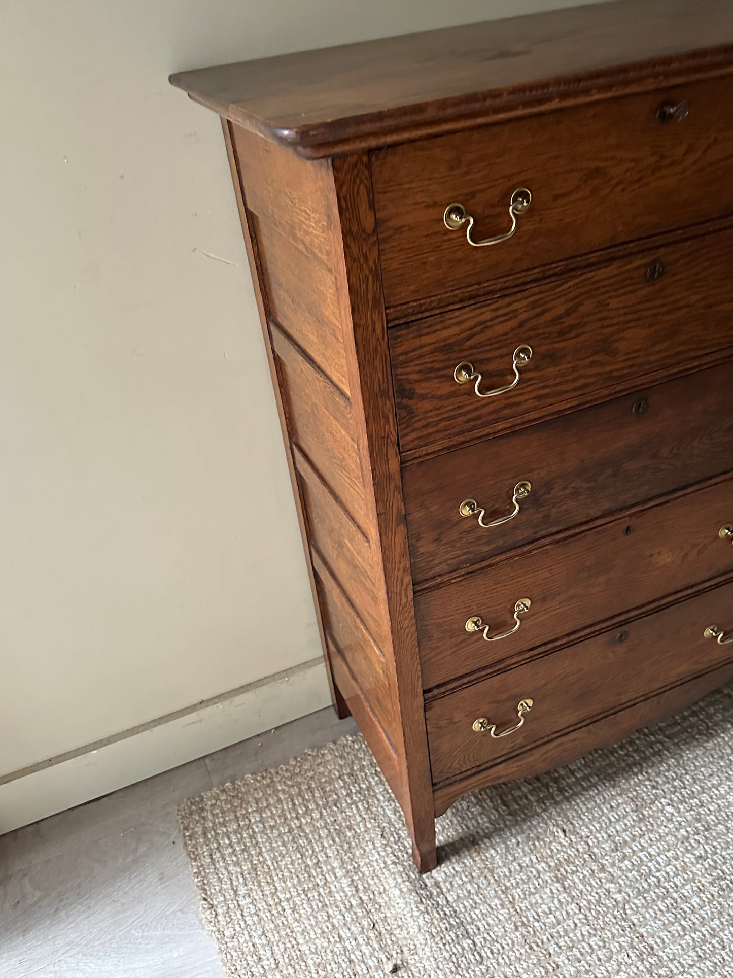 Oak tallboy with brass handles