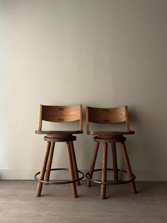 Conant Ball oak swivel bar stools. Sold as a pair.