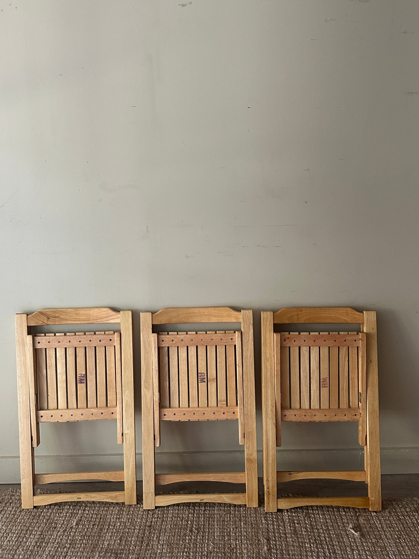 Oak folding chairs. Sold individually.