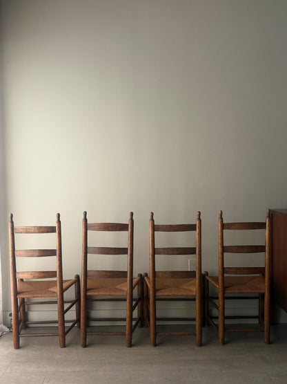 Pine ladder back rush seat chairs. Sold as a set of 4.