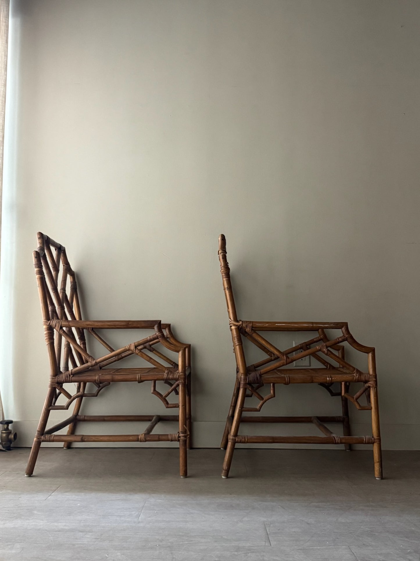 Bamboo arm chairs. Sold individually.