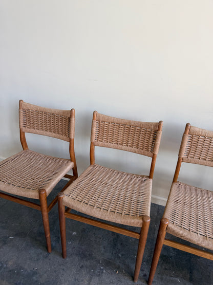 Danish oak and papercord chairs. Sold individually.
