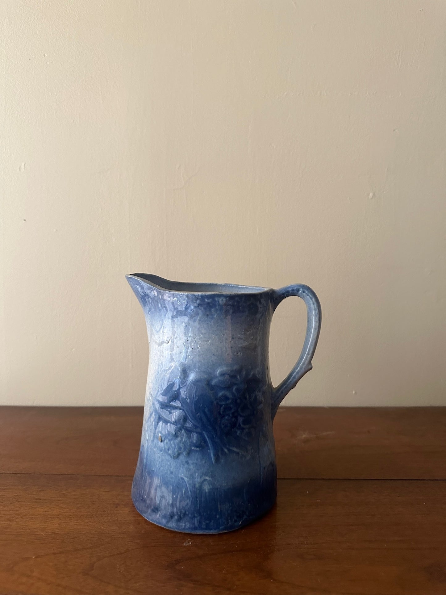 Salt glazed stoneware pitcher with birds and flowers