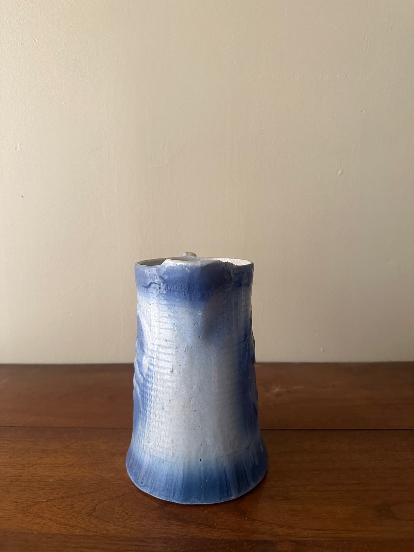 Salt glazed stoneware pitcher with fruit