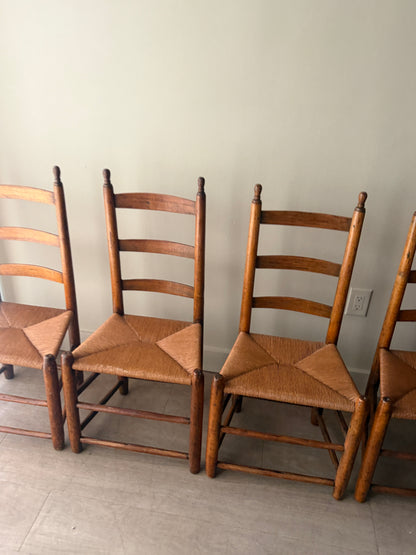 Pine ladder back rush seat chairs. Sold as a set of 4.