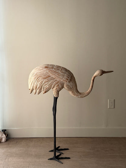 Wooden carved egret statue with iron legs