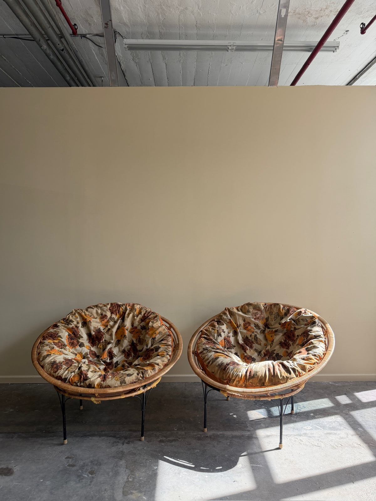 Wicker & metal circular lounge chairs. Sold individually.