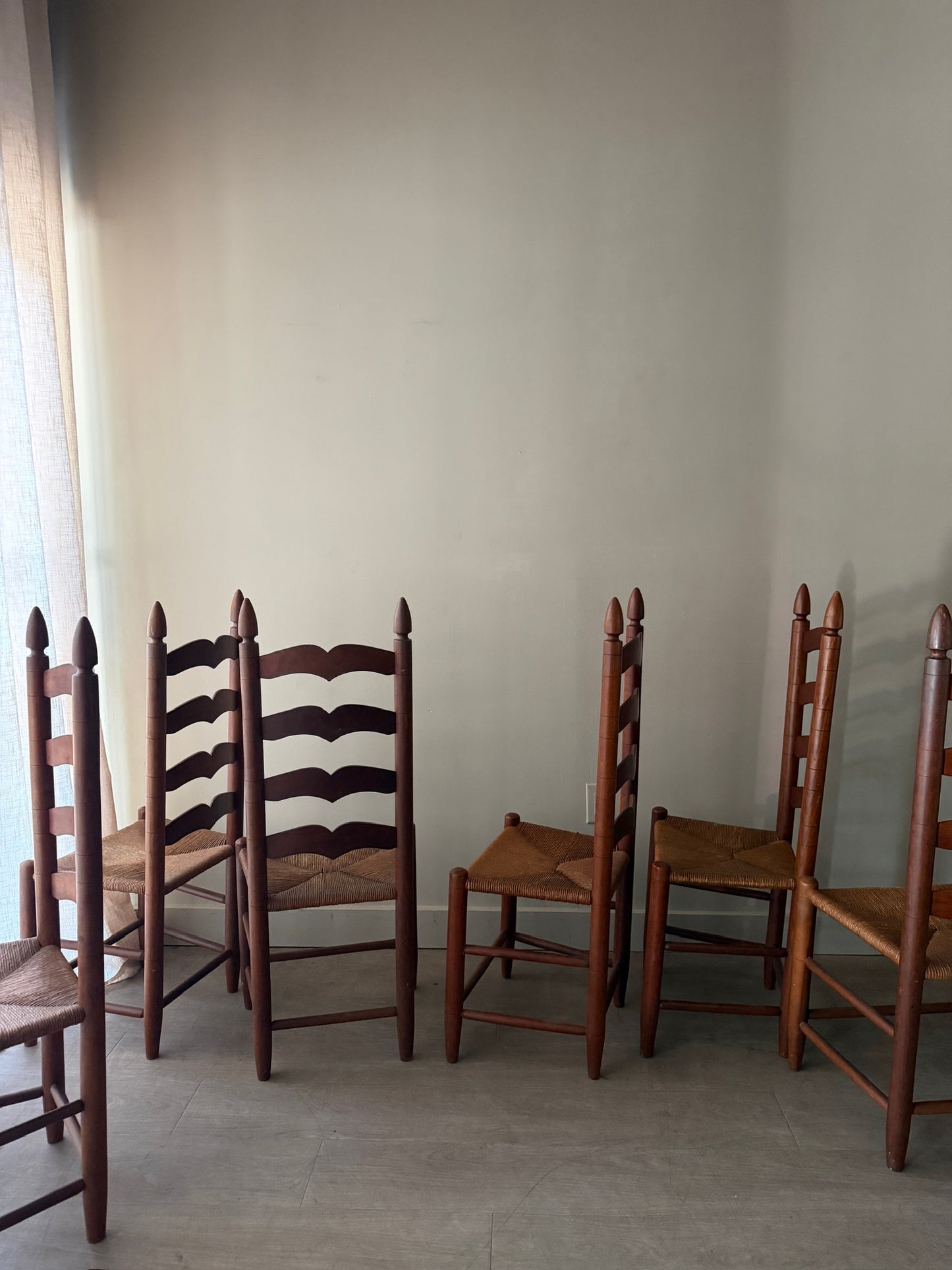 Cherry ladder back rush seat dining chairs. Sold in pairs.