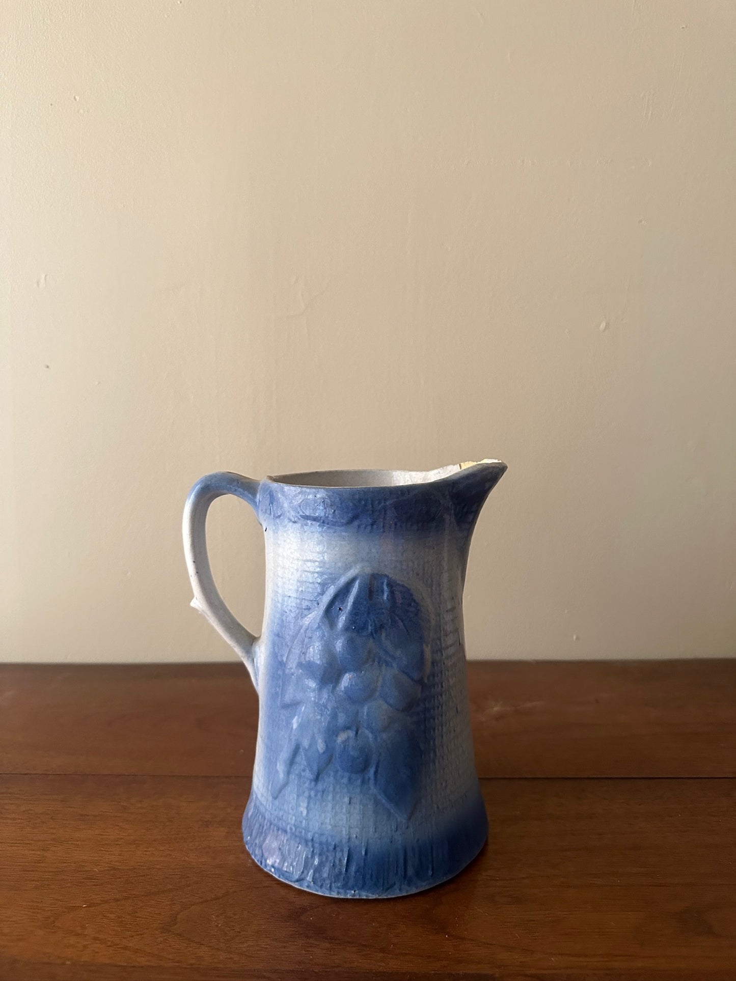 Salt glazed stoneware pitcher with fruit