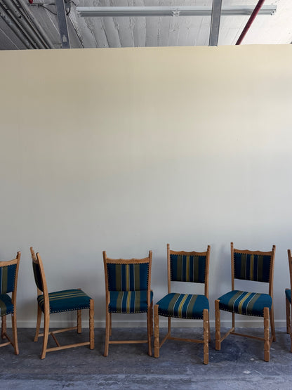 Henning Kjaernulf oak upholstered dining chairs. Sold in pairs.