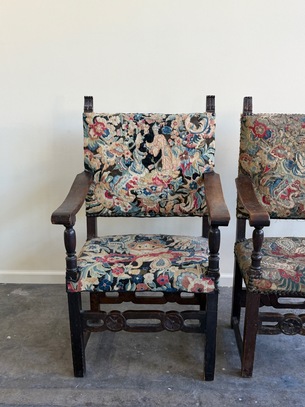 Italian Baroque upholstered walnut armchairs (left)