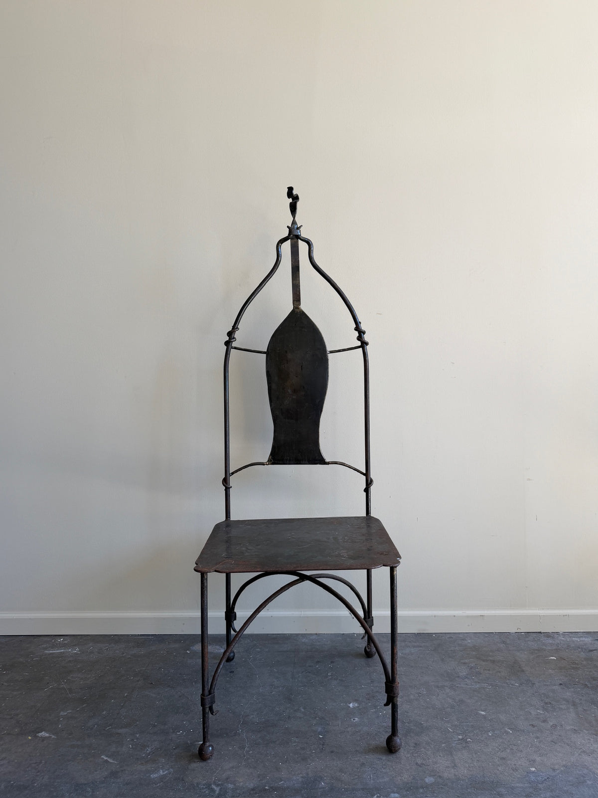 Wrought iron sculptural chairs (left)