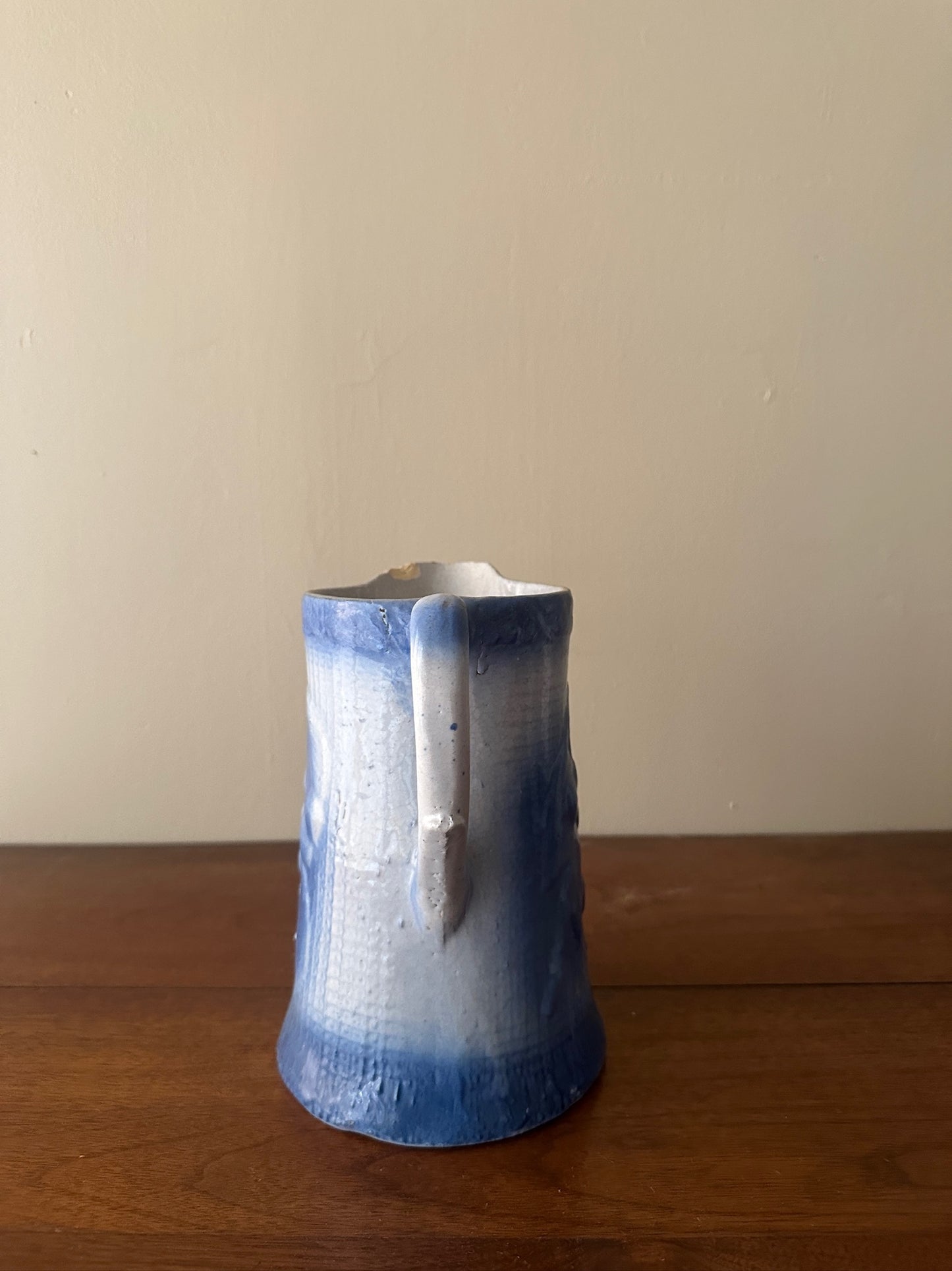 Salt glazed stoneware pitcher with fruit