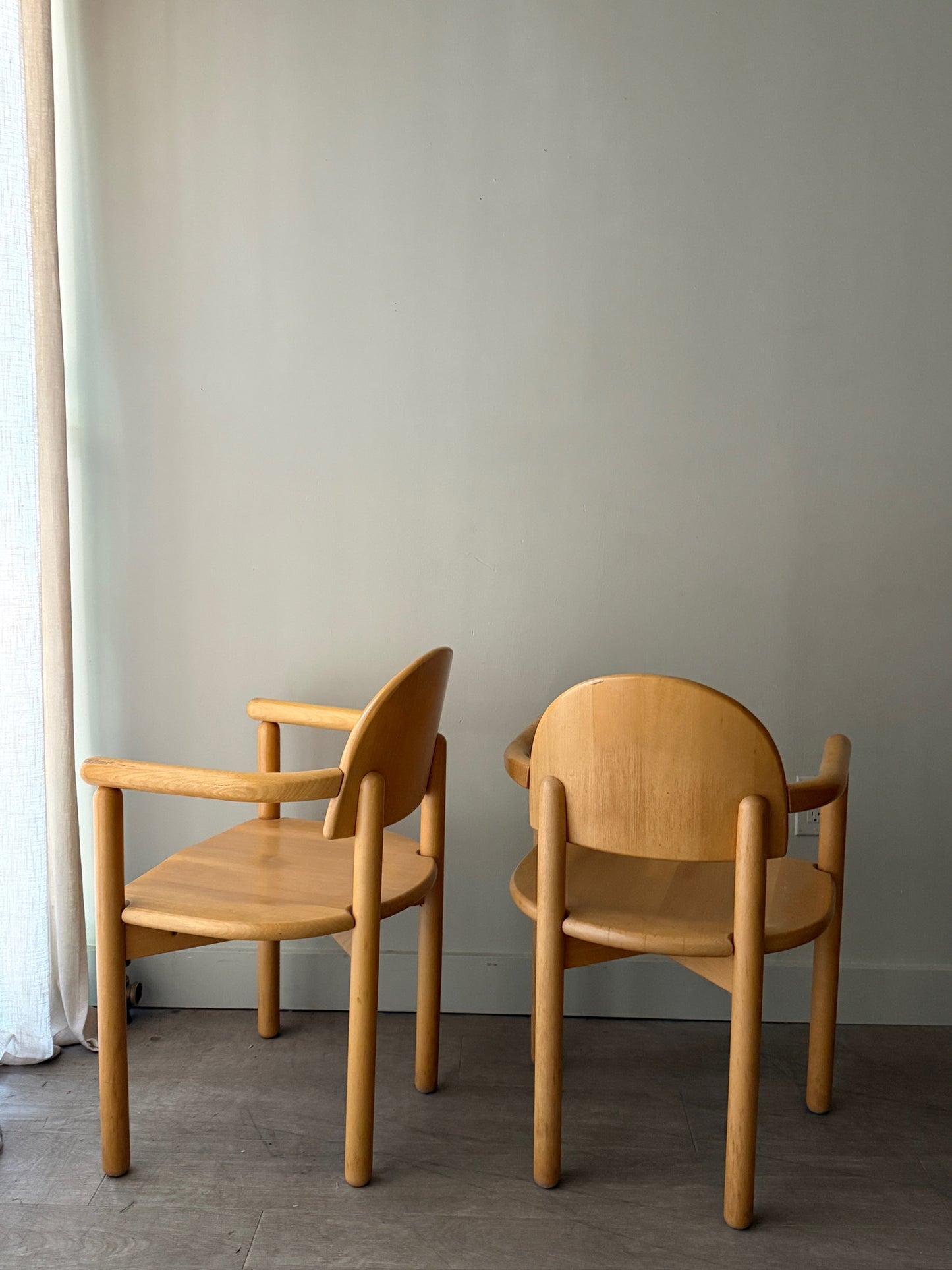 Rainer Daumiller pine dining chairs with arms. Sold individually.