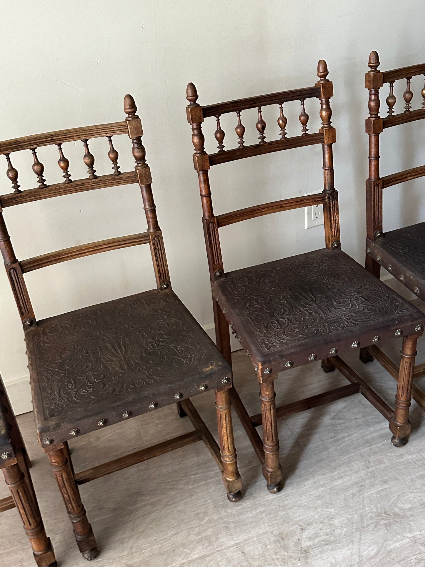 Embossed leather chairs. Sets of 2.