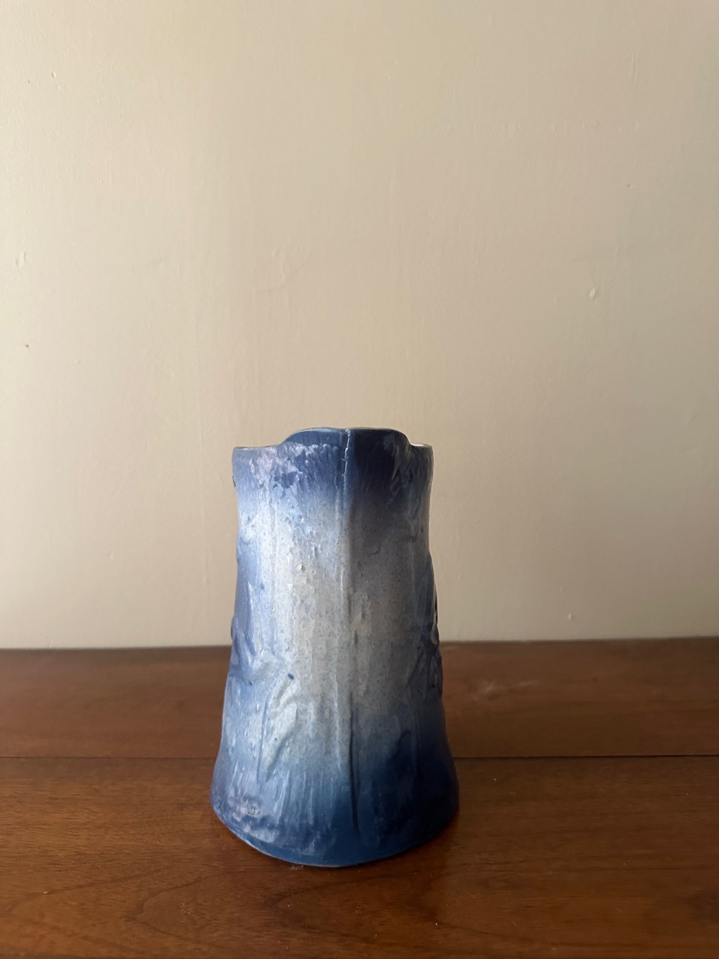 Salt glazed stoneware pitcher with birds and flowers