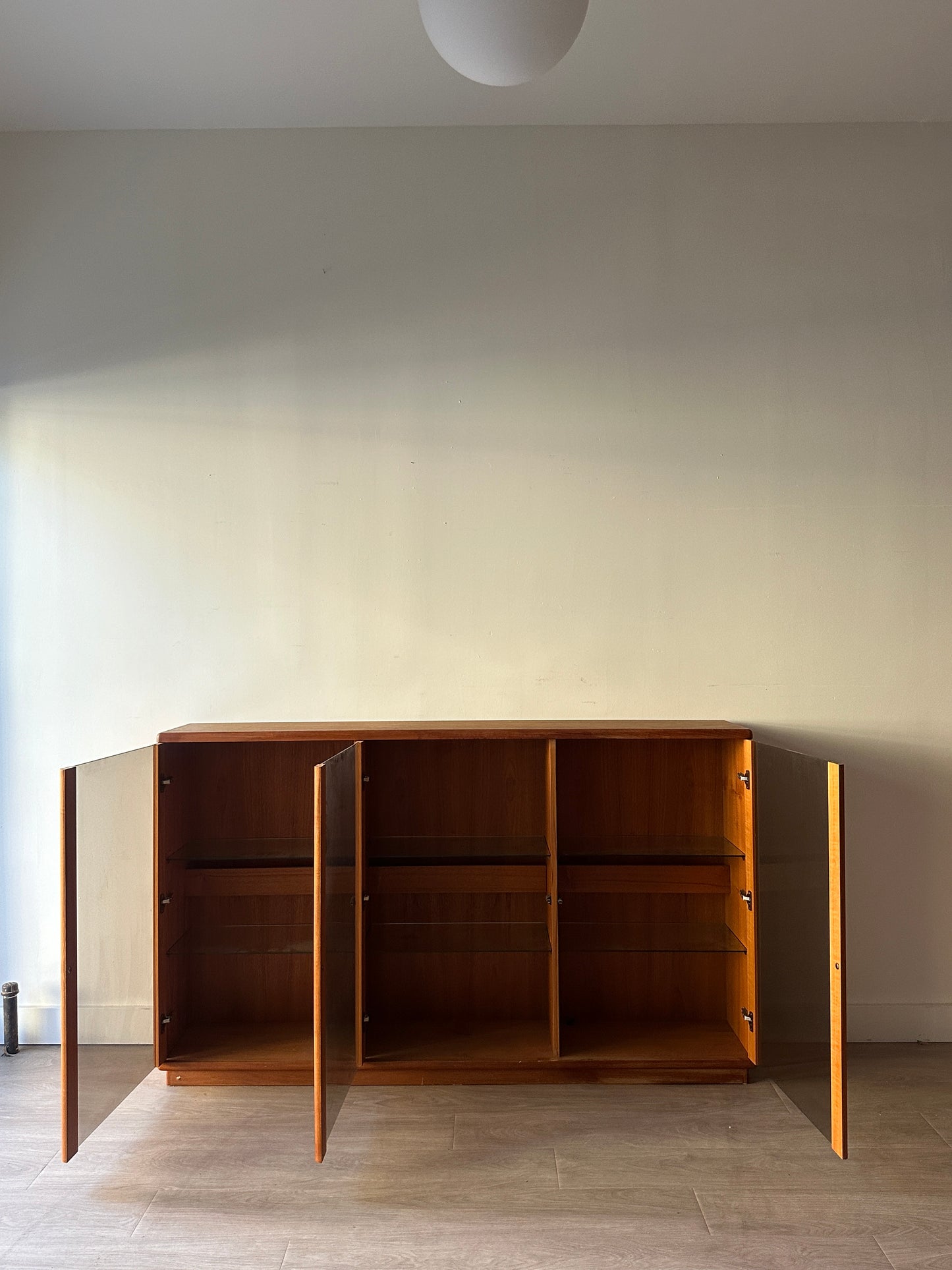 Smoked glass and teak bookcase