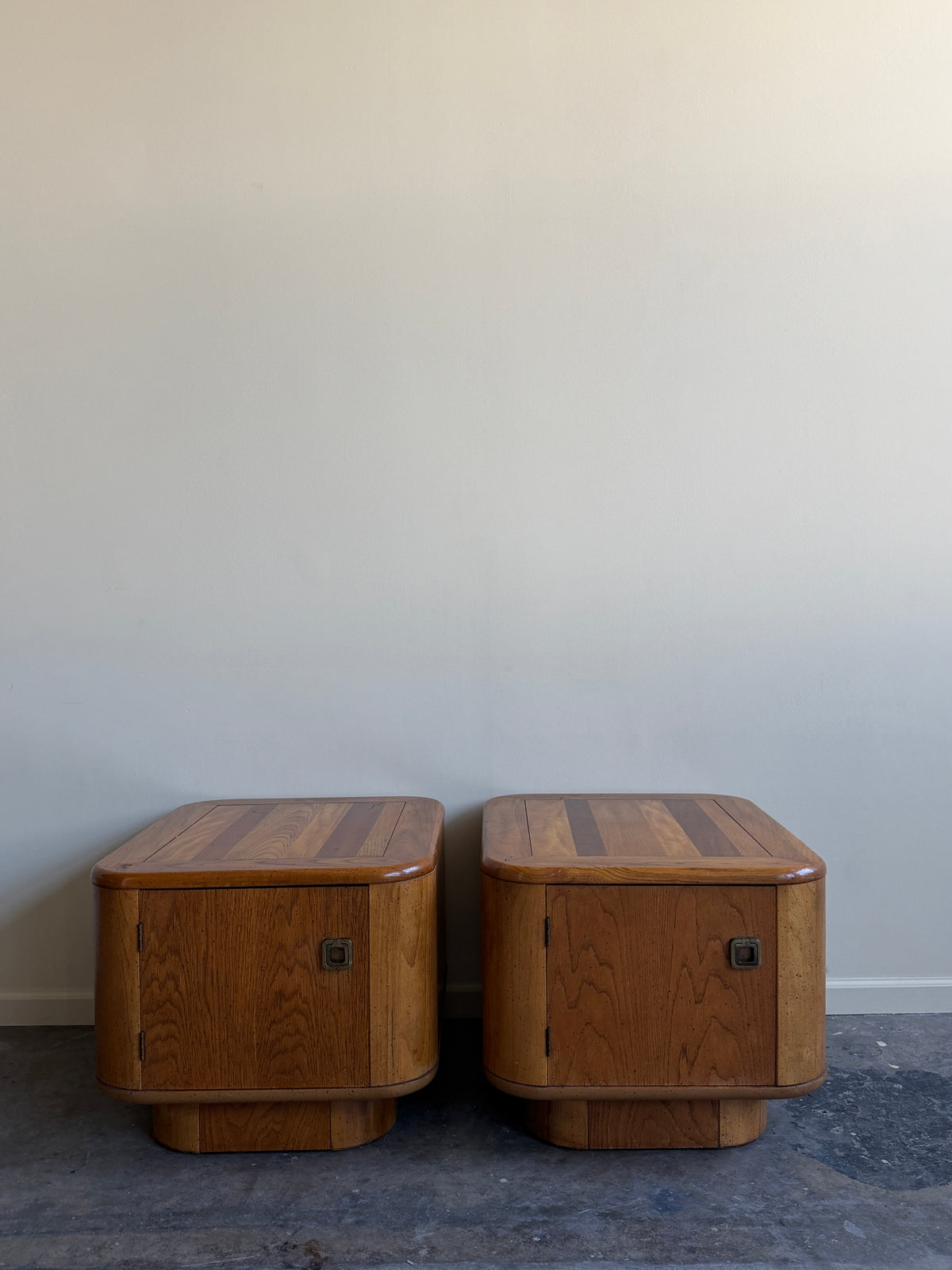 Bassett walnut nightstands. Sold as a pair.
