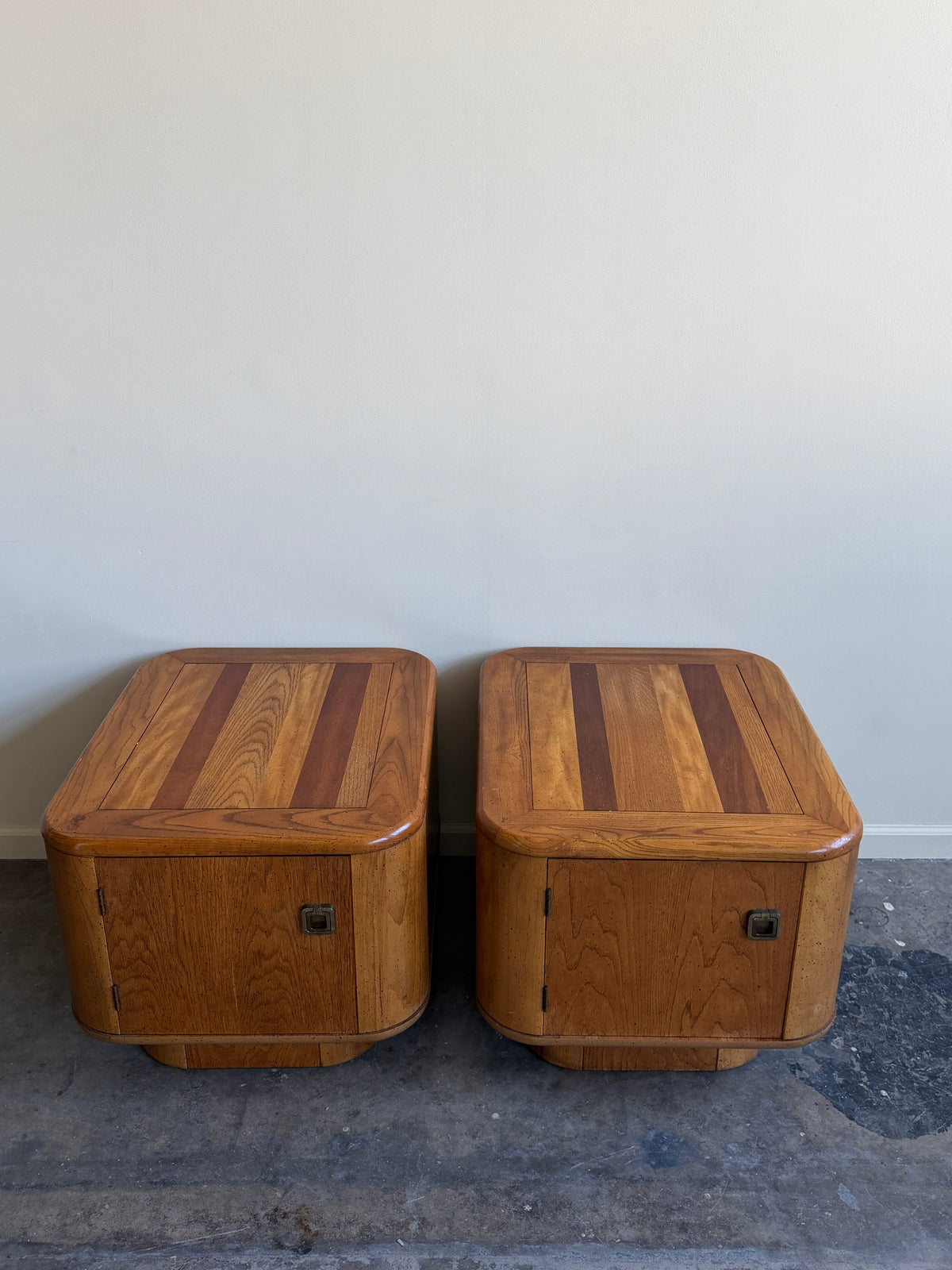 Bassett walnut nightstands. Sold as a pair.