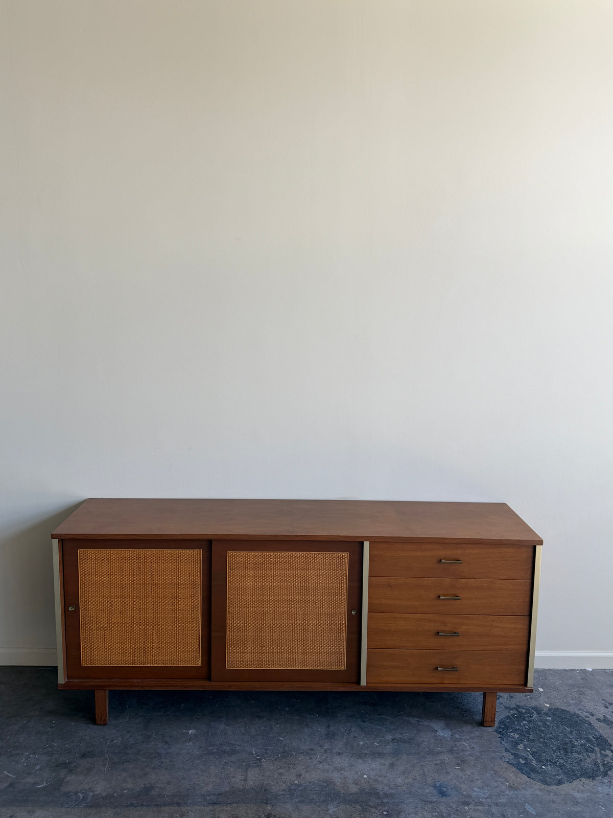 Walnut credenza with caned sliding doors