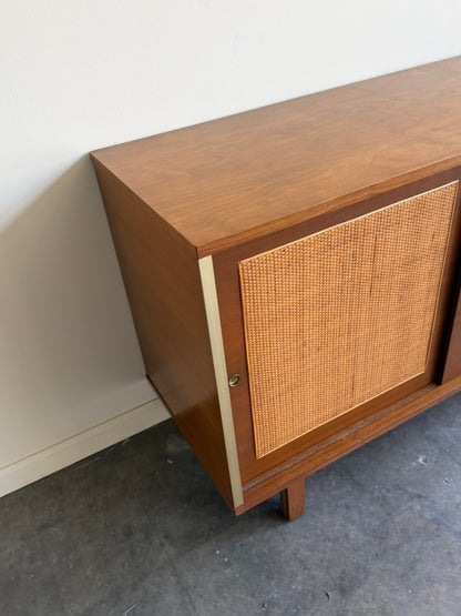 Walnut credenza with caned sliding doors