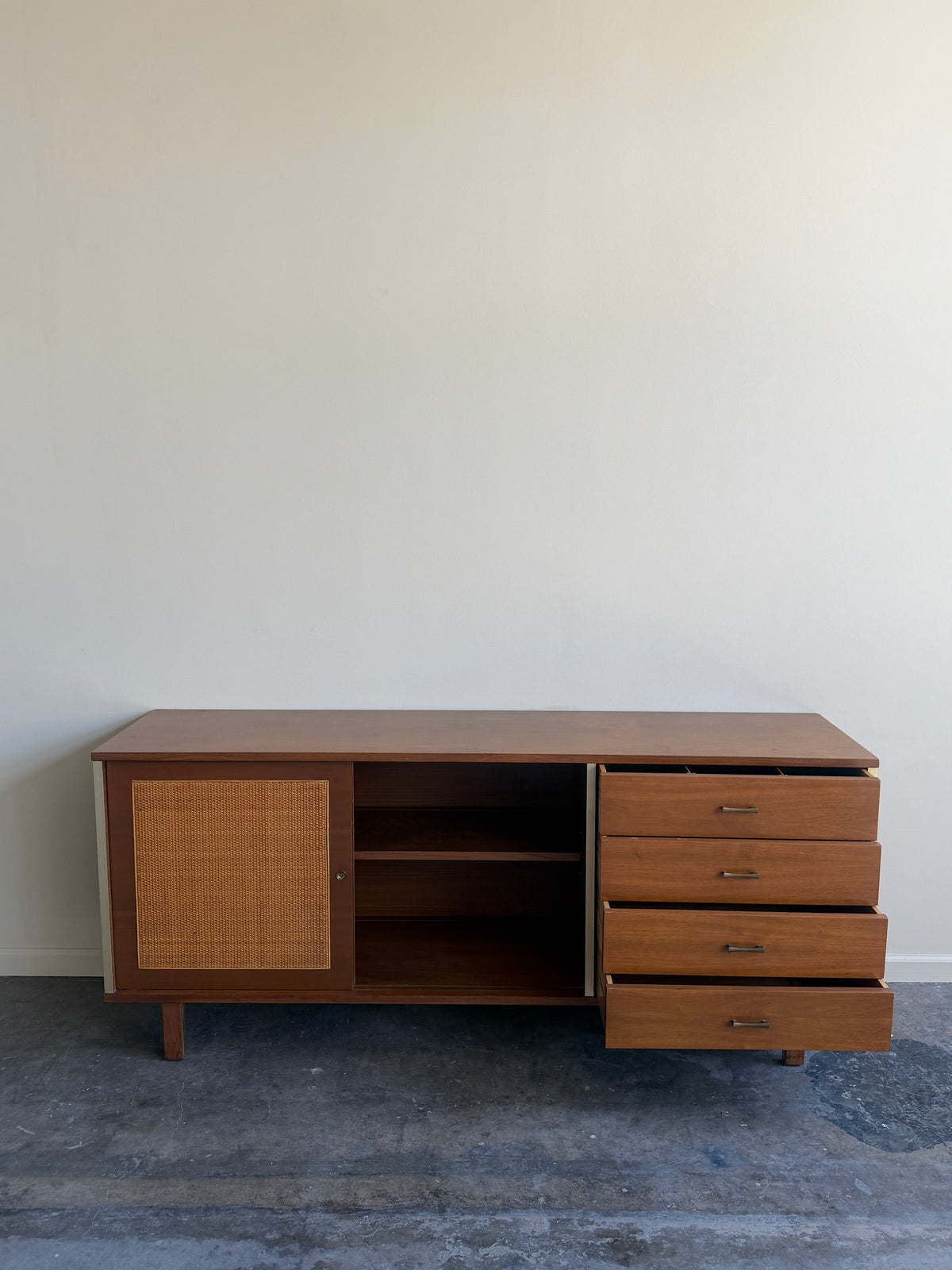 Walnut credenza with caned sliding doors